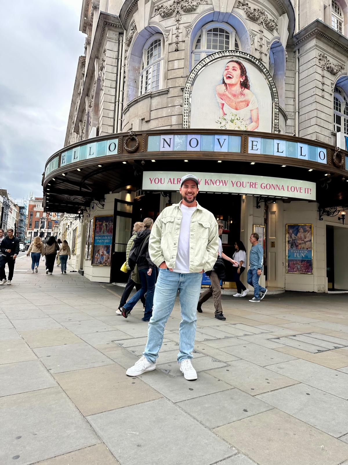 John-Paul outside the Novello Theatre in London